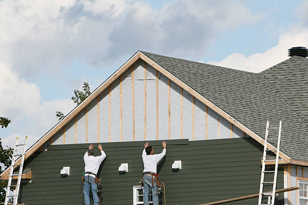 Professional Storm Damage Siding Repair technician working in Williamsport, MD
